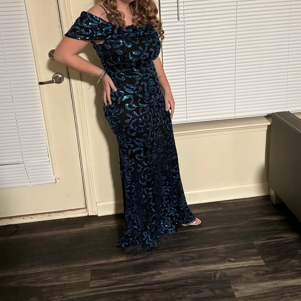 Size Large formal gown. Worn once for my daughters teen board formal.